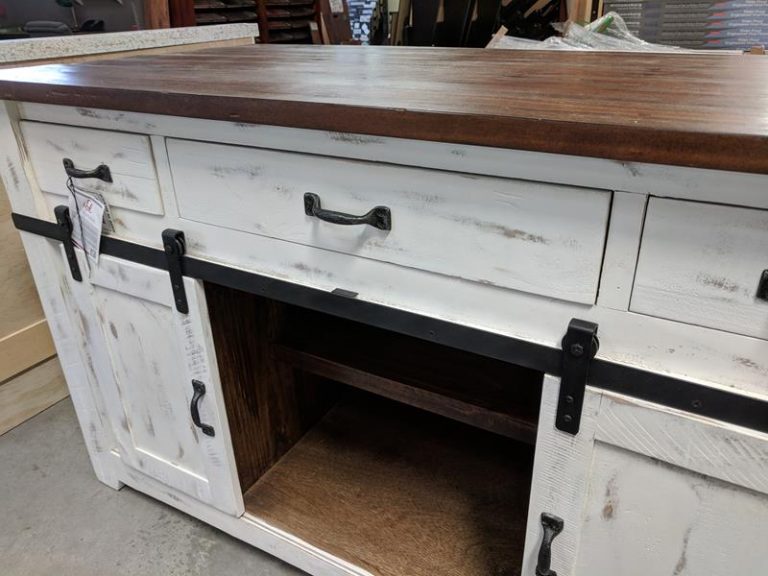 distressed white cabinet with barn door